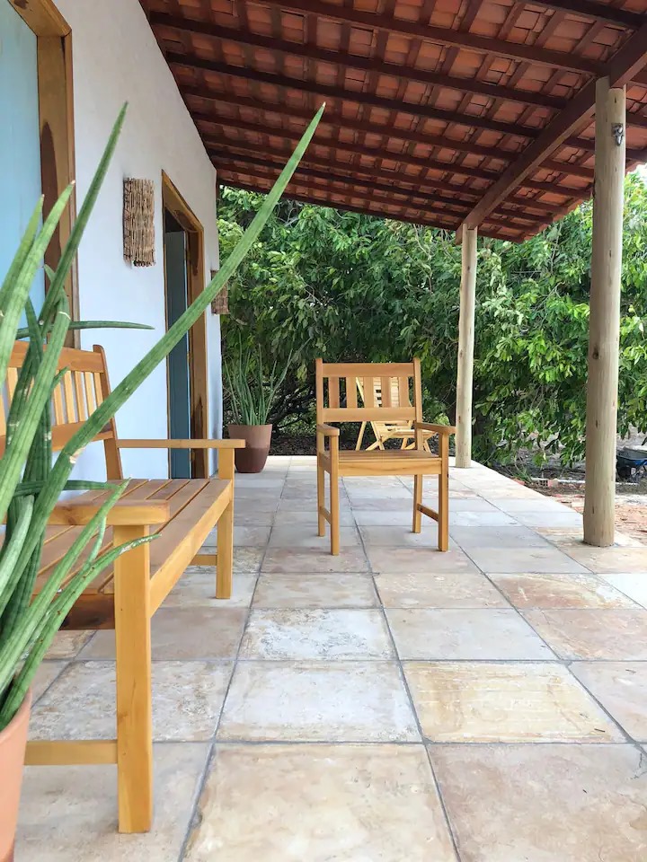 Covered terrace with wooden chairs